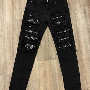 AMIRI Black Skinny Jeans with Distressed Details